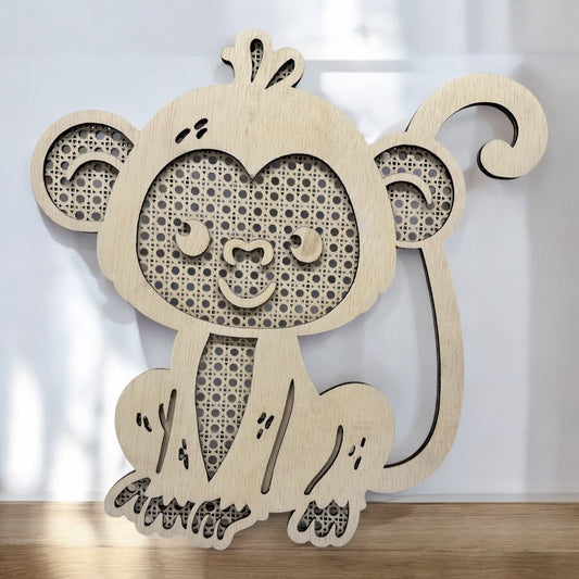 Wooden monkey wall decoration on a white background