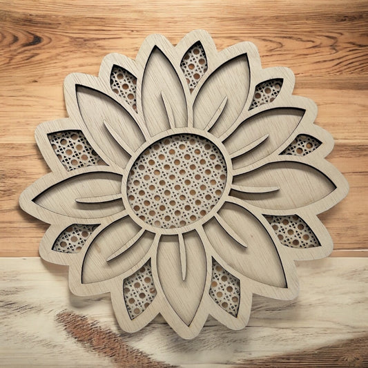Wooden sunflower decorative item on a wooden surface