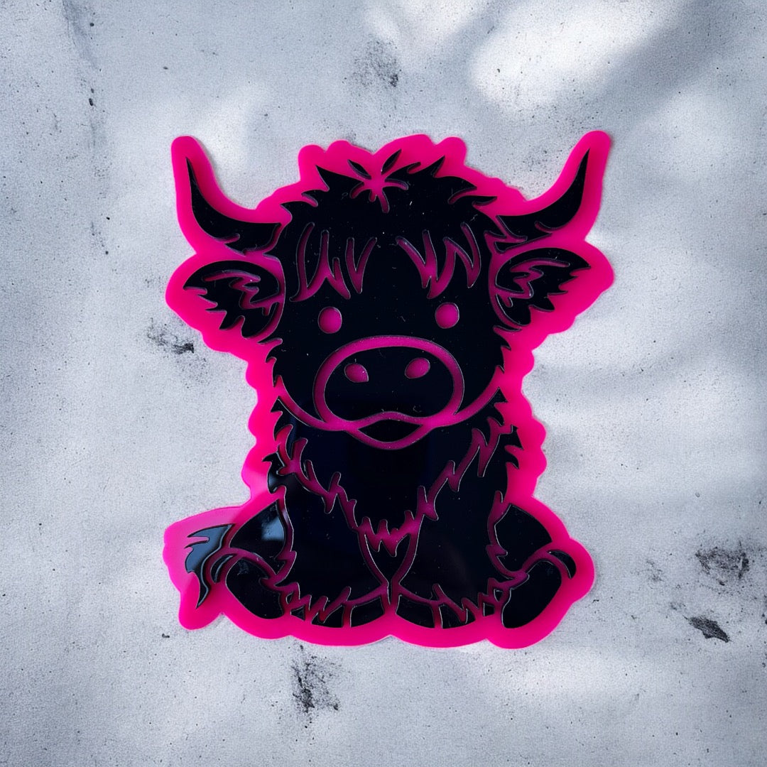 Black and pink acrylic of a Highland cow on a textured white background