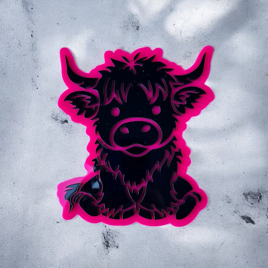 Black and pink acrylic of a Highland cow on a textured white background