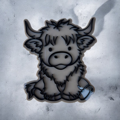 Black and white illustration of a cartoon Highlander cow on a textured gray background