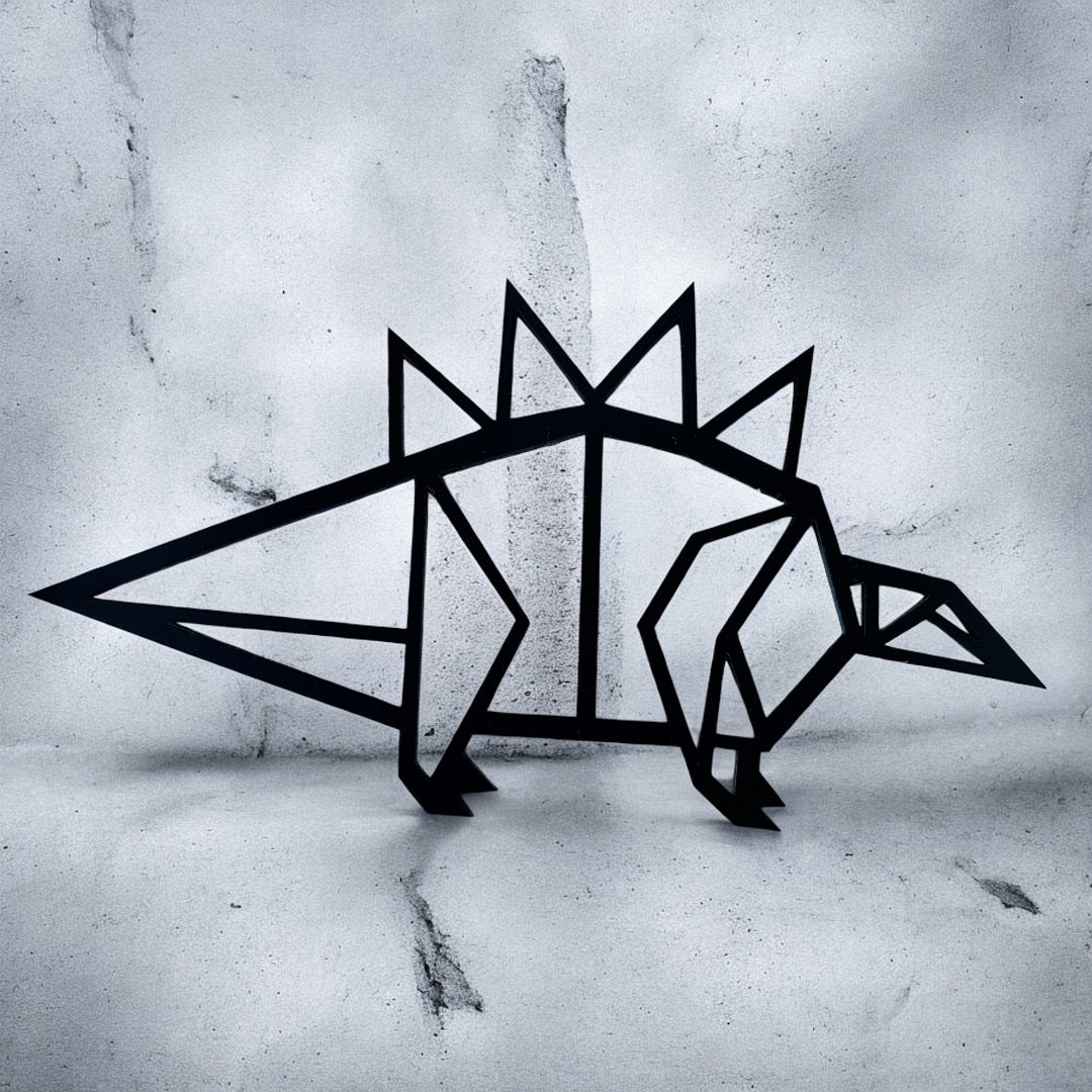 Geometric black stegosaurus wall decor on a textured gray surface
